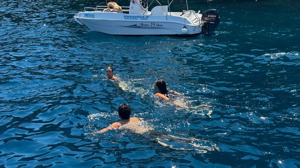 Swimming near a small motorboat
